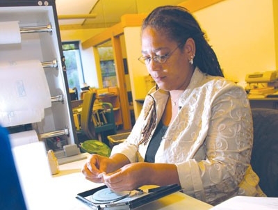 Woman cataloging a DVD