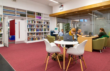 Students in a UCL library space