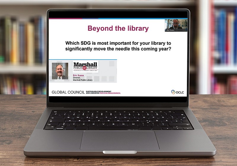 Photo illustration: Sustainability webinar on laptop in library